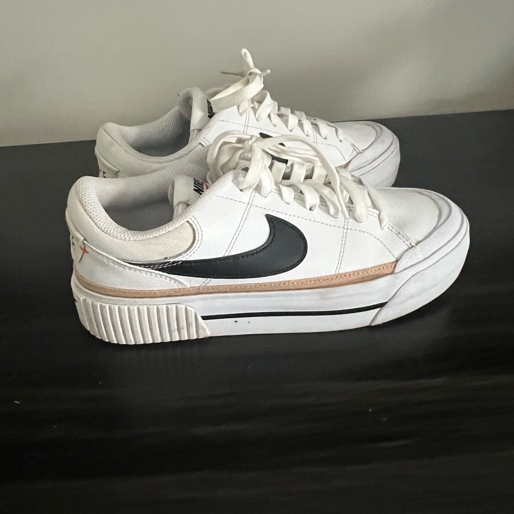 Nike White Low-Top Sneakers with Black Swoosh and Beige Trim
